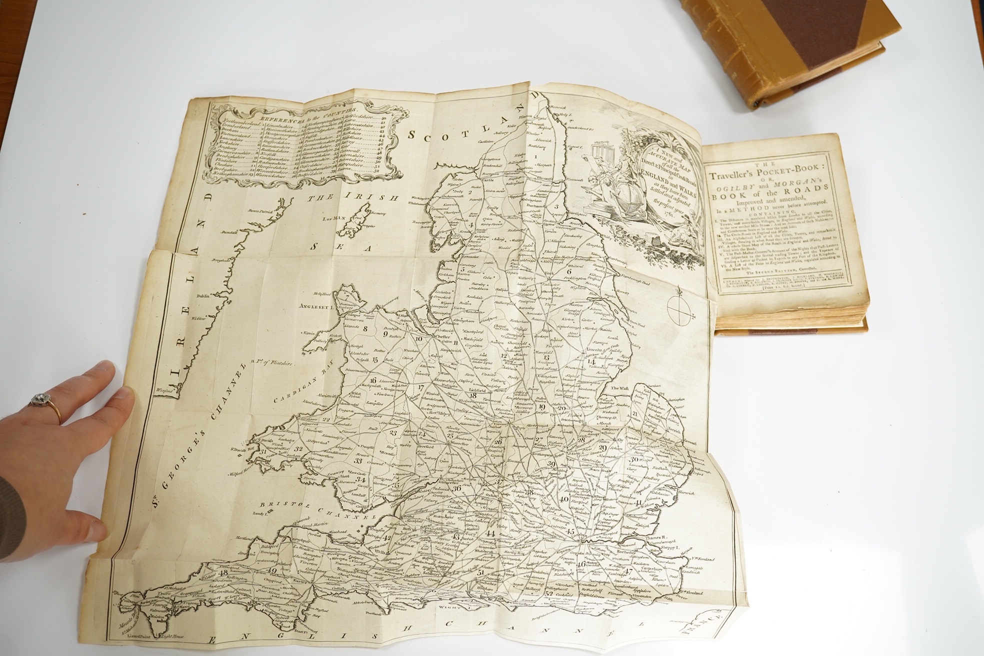 The Traveller's Pocket Book: or, Ogilby and Morgan's Book of Roads improved and amended ... the second edition, corrected. folded map (pictorial engraved title and a reference key with cartouche surround); newly rebound